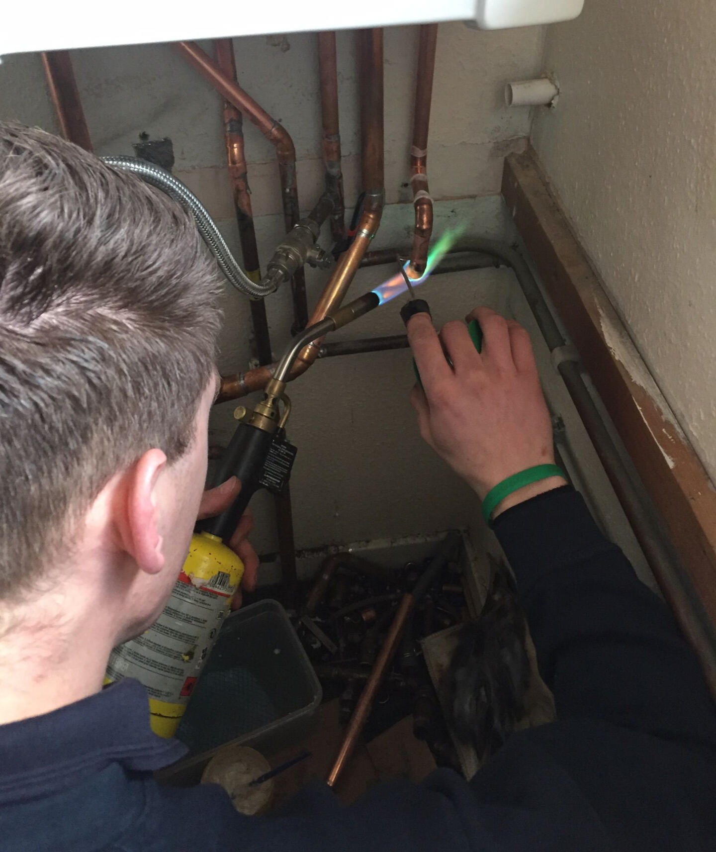 Source Ignition engineer fixing a boiler unit
